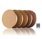 different skin tone makeup compacts on white background